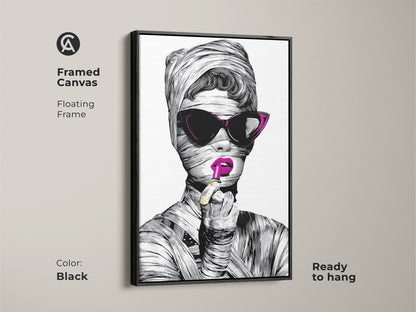 Framed Canvas of a stylish woman portrait. The black floating frame enhances the fashionable woman artwork. She is in a surreal black and white art print. The modern eclectic decor is ready to hang as glam bedroom art.