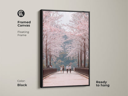 Enhance your space with this framed canvas art. A black floating frame highlights a couple walking under cherry blossoms. This contemporary nature art adds elegance to any room. Ready to hang this romantic spring scene brings seasonal beauty to your home.