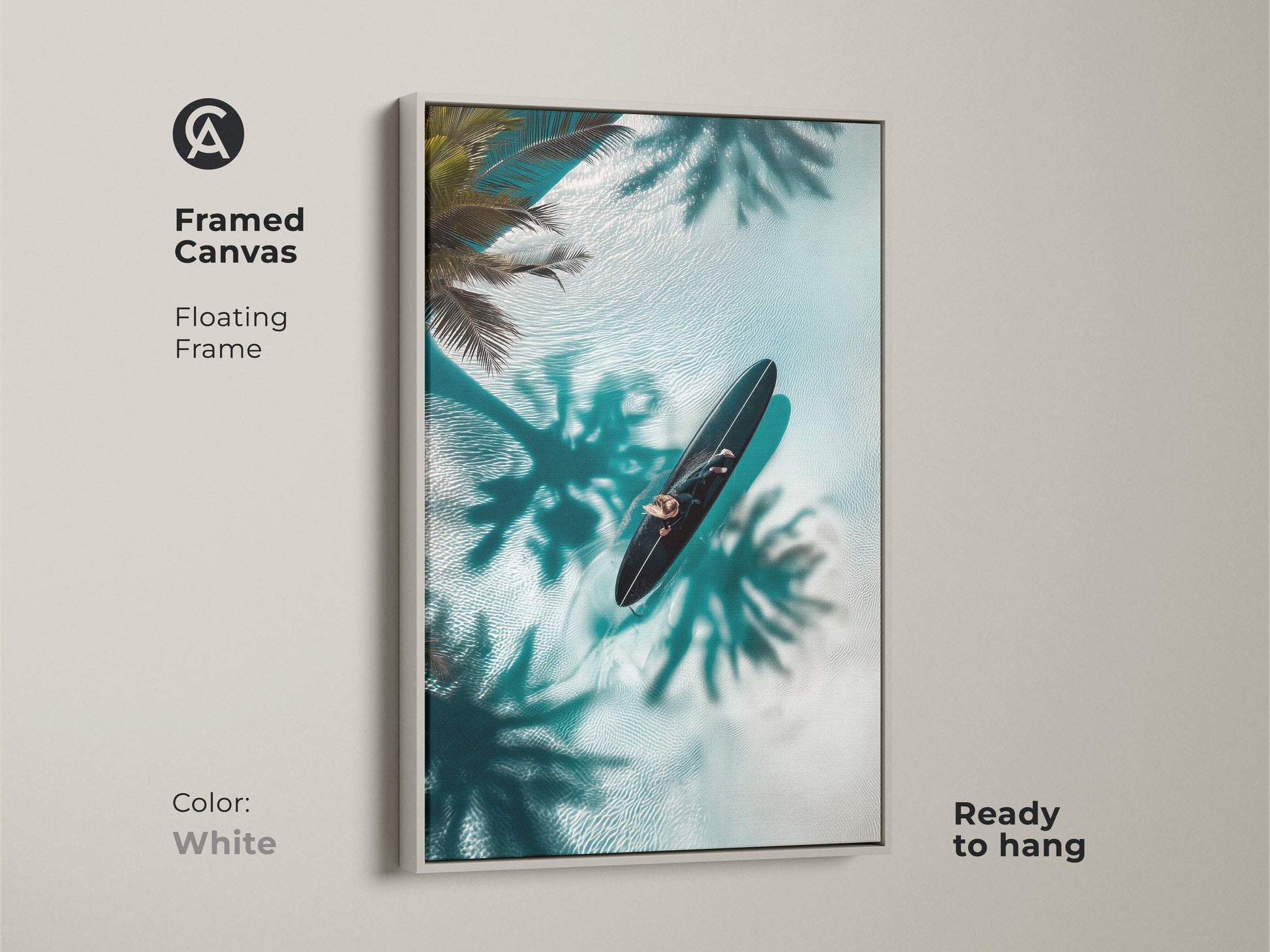 Brighten your home with this framed canvas art in white. The artwork captures a person on a surfboard in crystal-clear water. Palm shadows create a serene tropical scene. The floating frame adds a clean modern touch to this coastal piece. Ready to hang for an instant decor upgrade.