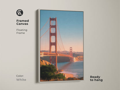 White framed canvas of the Golden Gate Bridge. This San Francisco cityscape print offers a coastal ocean view. Ready to hang travel photography decor. The red bridge artwork highlights the Bay Area landscape for any wall.
