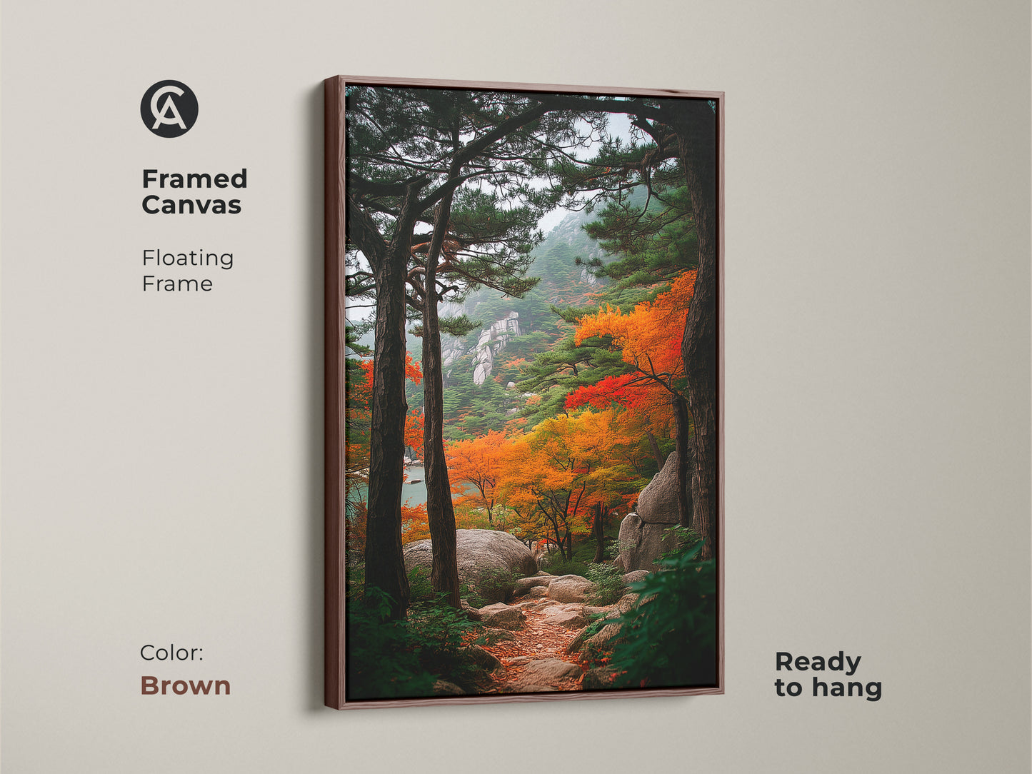 Framed canvas art of an autumn mountain path. The brown floating frame complements the nature artwork. This ready-to-hang piece adds warmth to any room. It's ideal for landscape art lovers.