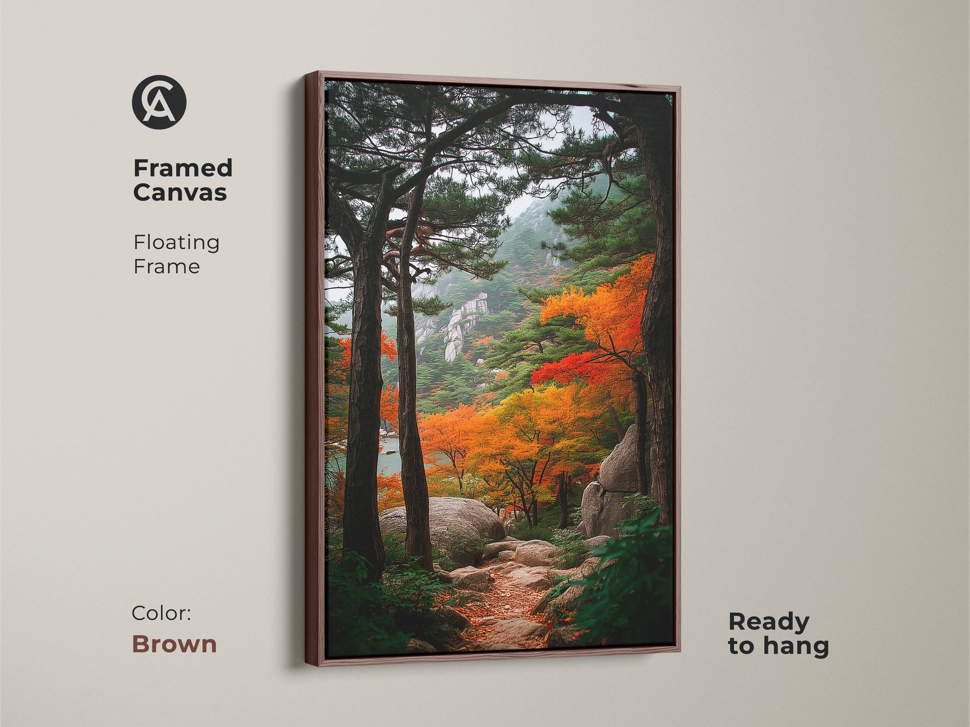 Framed canvas art of an autumn mountain path. The brown floating frame complements the nature artwork. This ready-to-hang piece adds warmth to any room. It's ideal for landscape art lovers.