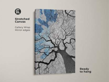 Stretched canvas art featuring an abstract oak tree under a blue sky. Gallery wrapped with mirror edges this piece is ready to hang. A nature-inspired artwork that combines modern lines with a minimalist tree. Perfect for adding a touch of contemporary charm to any room. This canvas print makes a unique housewarming gift.