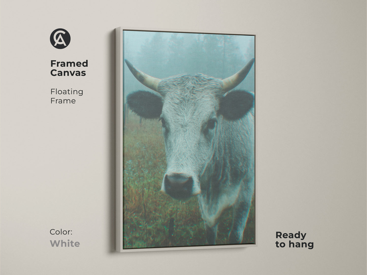 Framed canvas artwork showcasing a cow in a misty field with a white floating frame. This ready-to-hang piece offers a clean aesthetic to your home decor. It is a fresh and modern art choice.