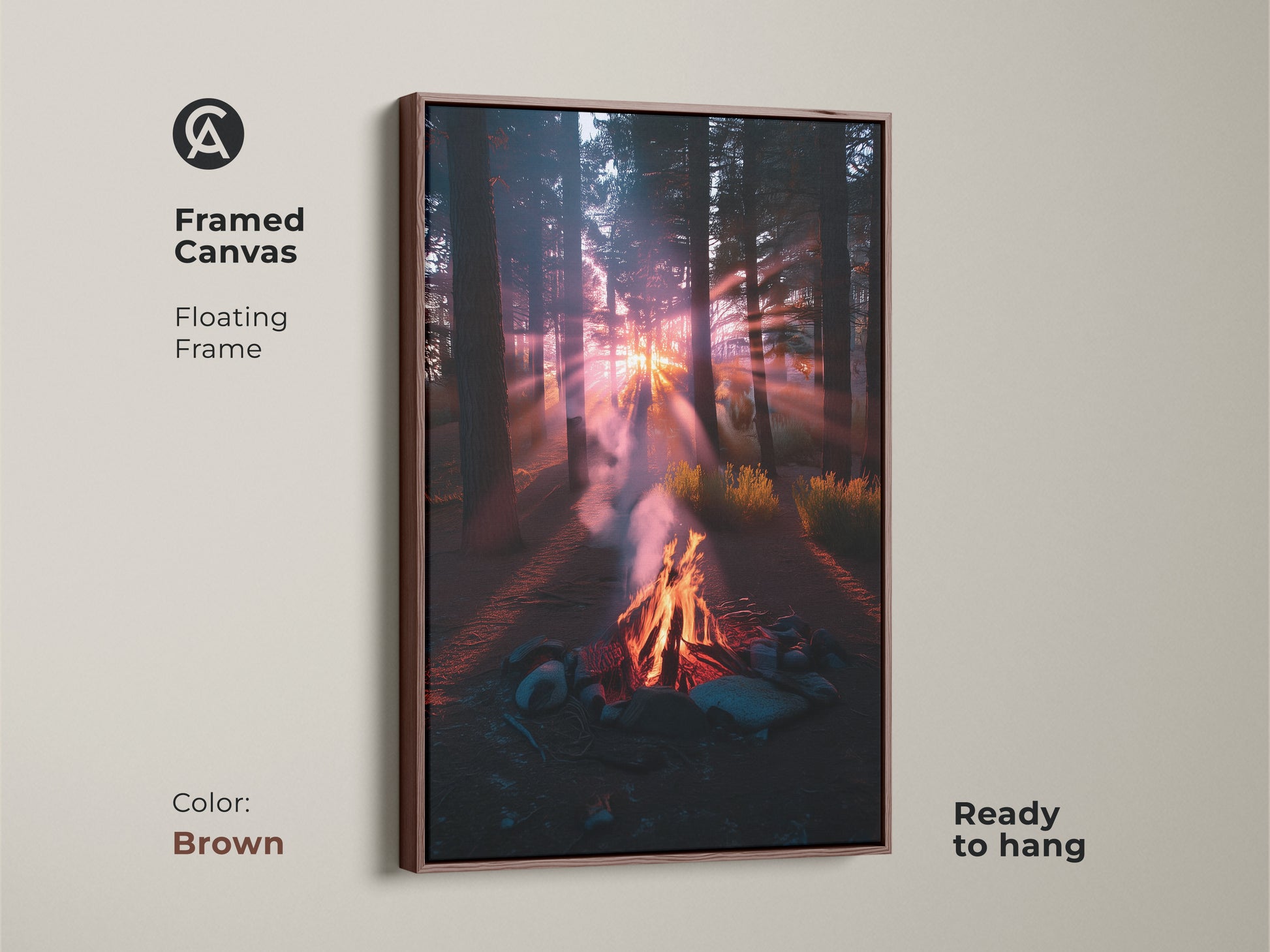 Framed canvas art featuring a campfire in the forest. This floating frame is brown. The rustic sunset landscape print adds warmth to any room. Ideal as fireplace wall hanging. This nature lover gift idea brings a peaceful nature scene to your home.