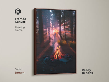 Framed canvas art featuring a campfire in the forest. This floating frame is brown. The rustic sunset landscape print adds warmth to any room. Ideal as fireplace wall hanging. This nature lover gift idea brings a peaceful nature scene to your home.
