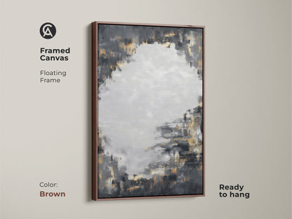 Framed canvas print featuring charcoal grey and gold abstract art with a brown floating frame. This textured brushstroke artwork is ready to hang. The modern abstract painting brings a contemporary feel to any space. Its neutral palette and metallic accents are versatile.