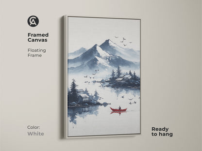 White framed canvas print of an ink wash mountain lake scene with a red boat. The Scandinavian landscape art offers blue and white mountain views. It's a peaceful nature wall art piece ready to hang. Perfect for adding a calm touch to any room.