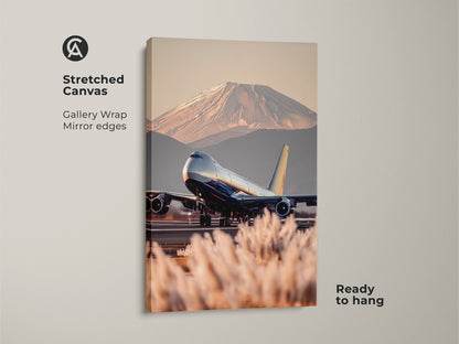 Stretched canvas art featuring a Boeing 747 taking off with Mount Fuji behind it. This gallery-wrapped travel photography canvas has mirrored edges. Ready to hang aviation art. The contemporary artwork uses blue gold and beige tones. A perfect housewarming gift for wanderlust and adventure art lovers.