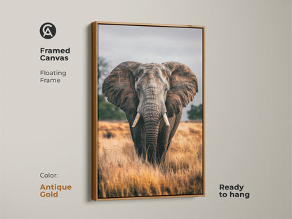 Framed canvas of an elephant portrait in antique gold. This wildlife wall art features a floating frame. The earthy brown and grey tones bring a rustic touch to your living room or bedroom. This ready to hang canvas is a perfect housewarming gift. The photorealistic animal is showcased in its natural habitat.