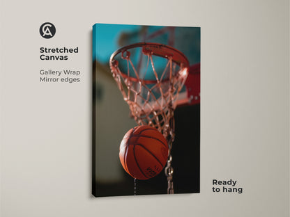 This is a stretched canvas basketball hoop art print. The gallery wrap has mirrored edges. This action shot basketball print is ready to hang. It features an orange and teal color palette. This contemporary sports artwork is ideal for sports-themed interiors.