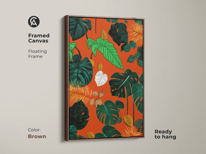 Framed canvas featuring a floating frame displays boho botanical art. Brown frame complements the tropical Monstera and fern leaves. The orange green and yellow nature pattern wall art enhances any space. Ready to hang this vibrant plant artwork is perfect for living room plant decor.