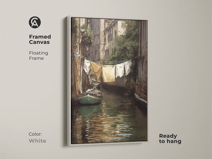 Framed canvas art presents a Venetian canal scene with hanging laundry. A white floating frame enhances this impressionistic cityscape wall art. Ready to hang this traditional European decor is perfect for any home. This waterscape painting print adds character to any room.