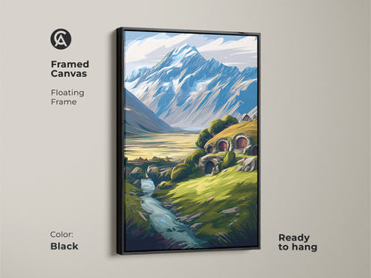 Framed canvas art of a fantasy hobbit hole landscape with a floating black frame. The mountain and river scene is ready to hang. This wall art is perfect for eclectic decor.
