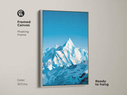 White framed canvas art featuring a snowy mountain range under a deep blue sky. Minimalist mountain decor perfect for an office space. A cool tone wall art piece that's ready to hang.