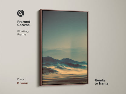 Framed canvas art featuring a misty mountain landscape with a floating frame in brown. This ready-to-hang piece offers a serene view. The artwork enhances your home decor. Its subtle colors create a peaceful atmosphere. Perfect for adding a touch of nature to your space.
