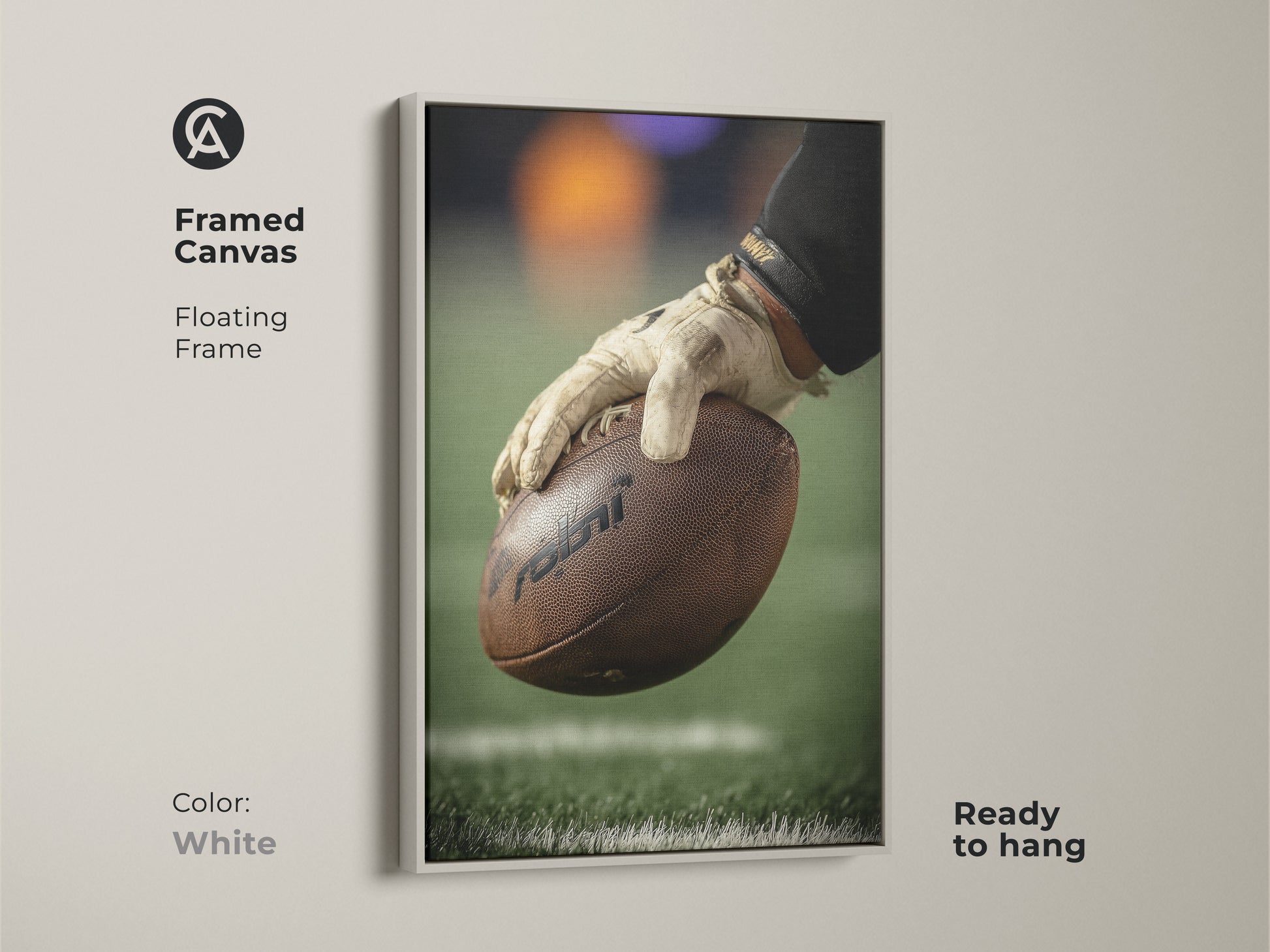 This framed canvas features a close-up of a football player's hand holding the ball. The floating white frame highlights the sports artwork. Ready to hang this canvas is great for a man cave. This art complements any sports enthusiast's space.