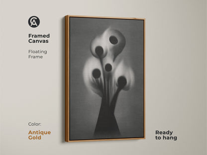 This framed canvas displays gothic flower artwork in black and white. It is a surreal botanical print with a white floating frame ready to hang. The dark academia style offers an alternative wall art. Bring a sophisticated artistic touch to your office.