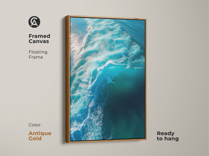 This framed canvas showcases a surfer riding a vibrant blue wave. The antique gold floating frame adds a touch of elegance. It makes the artwork stand out. Ready to hang. It brings a luxurious feel to any space. Ideal for adding a sophisticated coastal touch to your home.