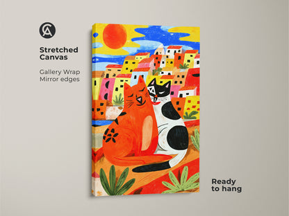 Boho naive cat art print on stretched canvas. The gallery wrap has mirror edges. It depicts two cats in a vibrant Mediterranean town. The artwork is ready to hang. Ideal as a housewarming gift for cat lovers.