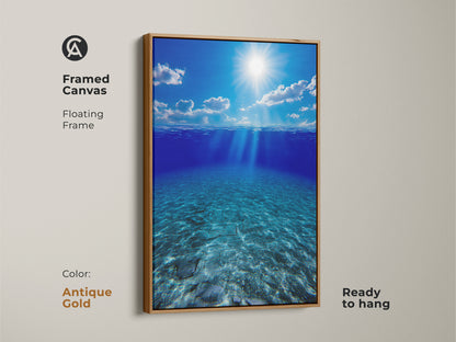 Framed canvas of underwater sunbeams in deep blue ocean with an antique gold floating frame. This ready-to-hang artwork features calming blue tones. This photorealistic seascape adds a touch of natural beauty to your home. A stunning housewarming gift for ocean enthusiasts.