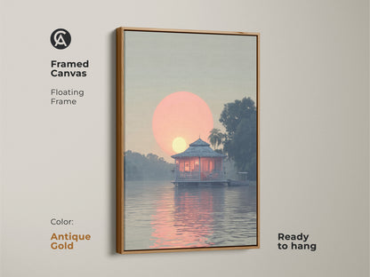Framed Canvas coastal lake house art with floating frame and antique gold color. The art features a peach and blue tropical landscape and a serene waterfront bungalow painting. This artistic bungalow landscape print is ready to hang.