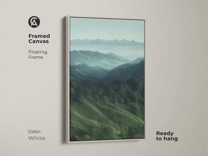 White framed canvas featuring a misty mountain landscape. Floating frame emphasizes this teal green nature artwork. Ready to hang this modern farmhouse decor. It's a great housewarming gift for hiker and outdoor lovers. Calming forest view art.