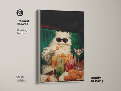 Framed canvas artwork of a persian cat wearing sunglasses. The floating frame is white. The cat is at a table with drinks and chicken nuggets. This funny artwork is ready to hang. It is perfect for cat lovers.