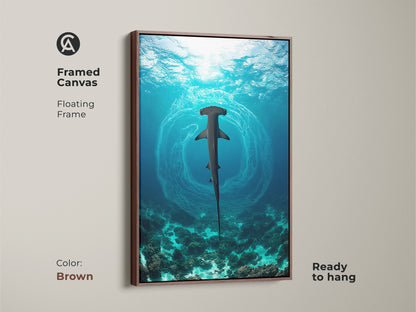 Framed coastal hammerhead shark art with a floating frame in brown. This underwater ocean wildlife print features deep blue aqua and teal tones. Ideal for marine life enthusiasts and coastal living rooms.