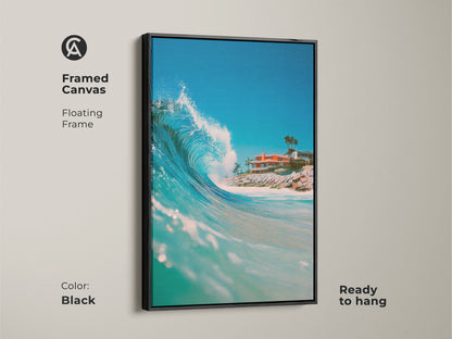 Framed canvas with a floating frame in black displaying ocean wave art. The artwork is ready to hang. The vibrant wave and coastal home create a serene atmosphere. Perfect for adding a touch of elegance to any room with this framed art.