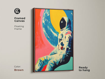 Framed Canvas of Retro Futurism Space Art. The floating frame is brown ready to hang. This sci-fi wall art depicts an astronaut in a contemporary style. Its bold colors will create a modern space decor in any room.
