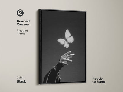 Framed canvas features a floating frame. Black and white abstract art is ready to hang. The insect and human touch print is contemporary bedroom decor. Find elegant living room canvas or a nature lover gift idea here.