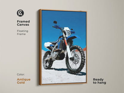 Antique gold framed canvas art of a blue and white motocross motorcycle. This floating frame enhances the high detail bike print. Ready to hang dirt bike artwork for a garage or man cave. A great gift for motorcycle riders.