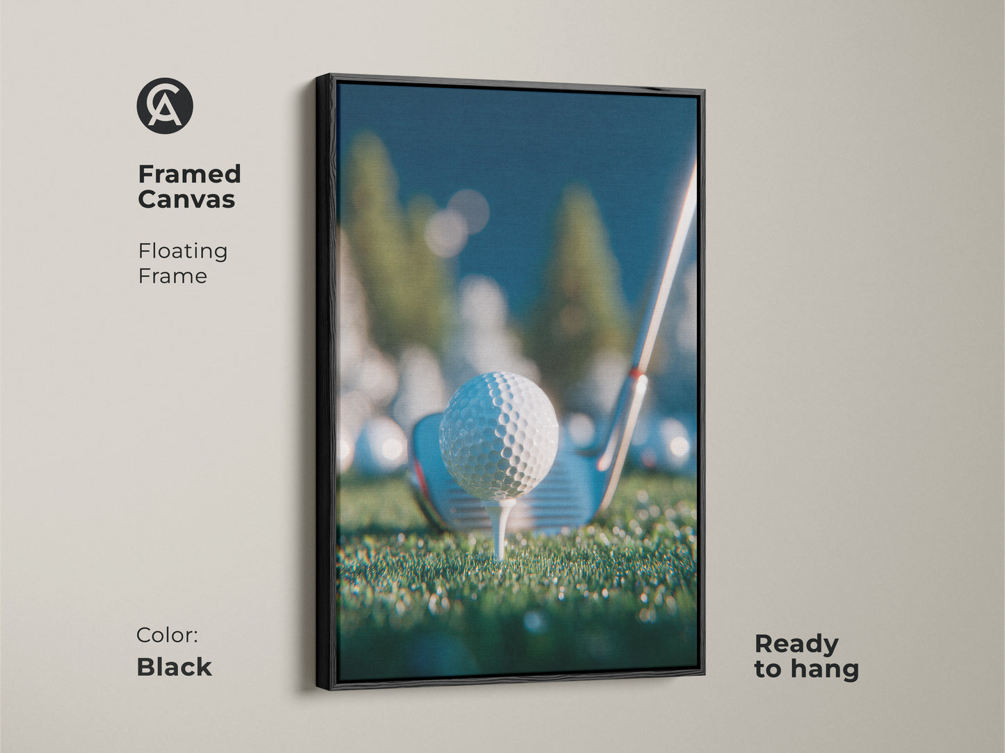 Framed canvas artwork in a black floating frame shows a golf ball on a tee. It comes ready to hang. The print is perfect for golf enthusiasts. Add a touch of sporty elegance to your space. Shop framed art now.