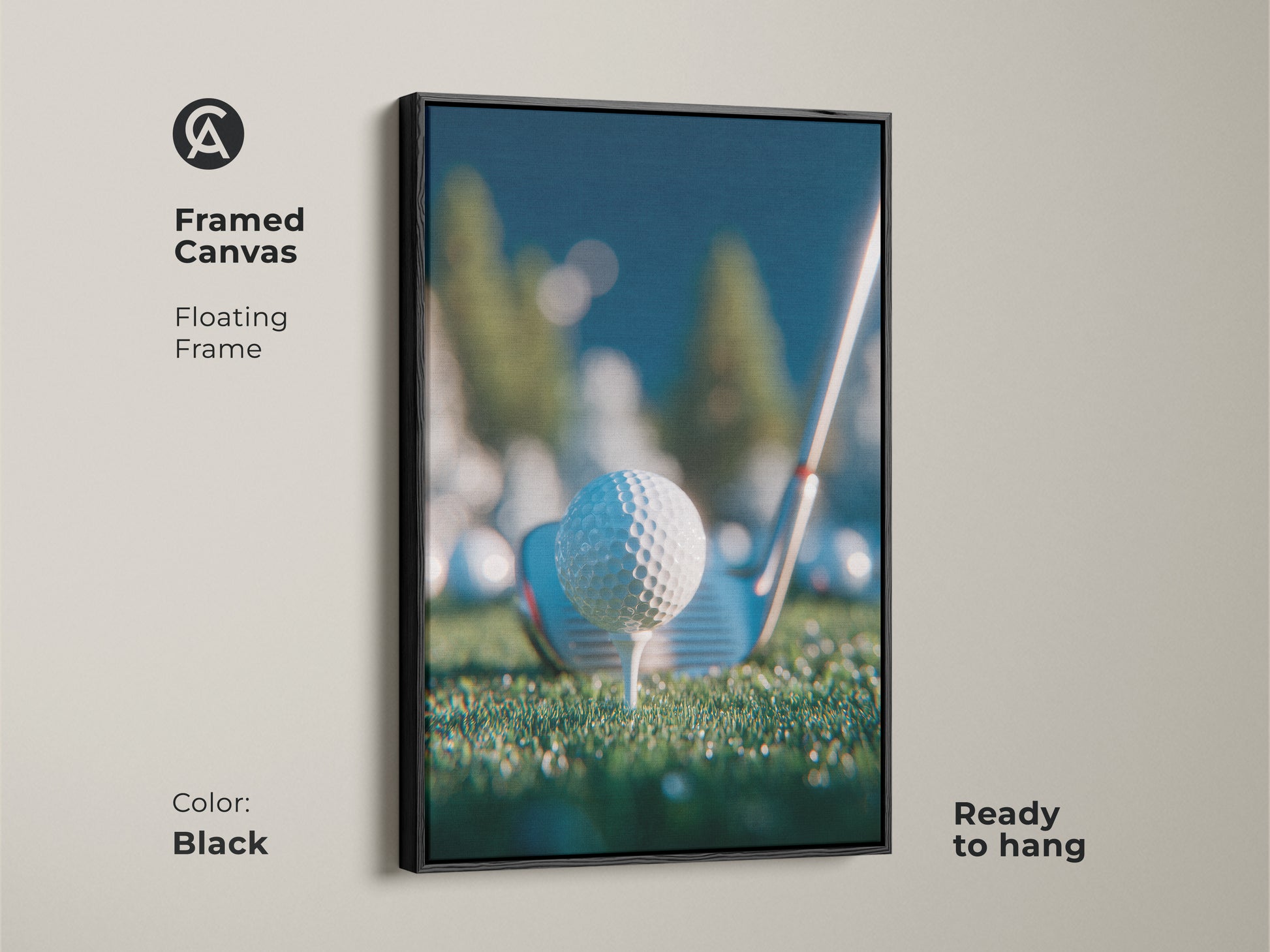 Framed canvas artwork in a black floating frame shows a golf ball on a tee. It comes ready to hang. The print is perfect for golf enthusiasts. Add a touch of sporty elegance to your space. Shop framed art now.