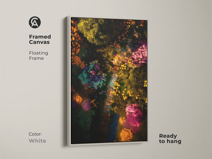 Framed canvas art featuring an aerial garden scene. The white floating frame highlights this colorful botanical artwork. This ready-to-hang print adds a fresh touch. Shop now for framed garden art to brighten your living space.