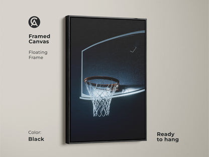 Framed canvas featuring a basketball hoop. The floating frame is black. Ready to hang. Minimalist sports art with a black blue net. Ideal wall art for a man cave or office. A perfect gift for basketball enthusiasts.