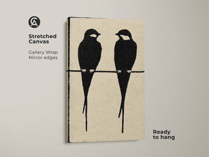 Stretched canvas featuring minimalist animal art. Two black bird silhouettes are showcased in this modern abstract piece. Gallery-wrapped with mirrored edges this artwork is ready to hang. This black cream bird art print enhances minimalist bedroom art. Perfect as a Scandinavian living room art.