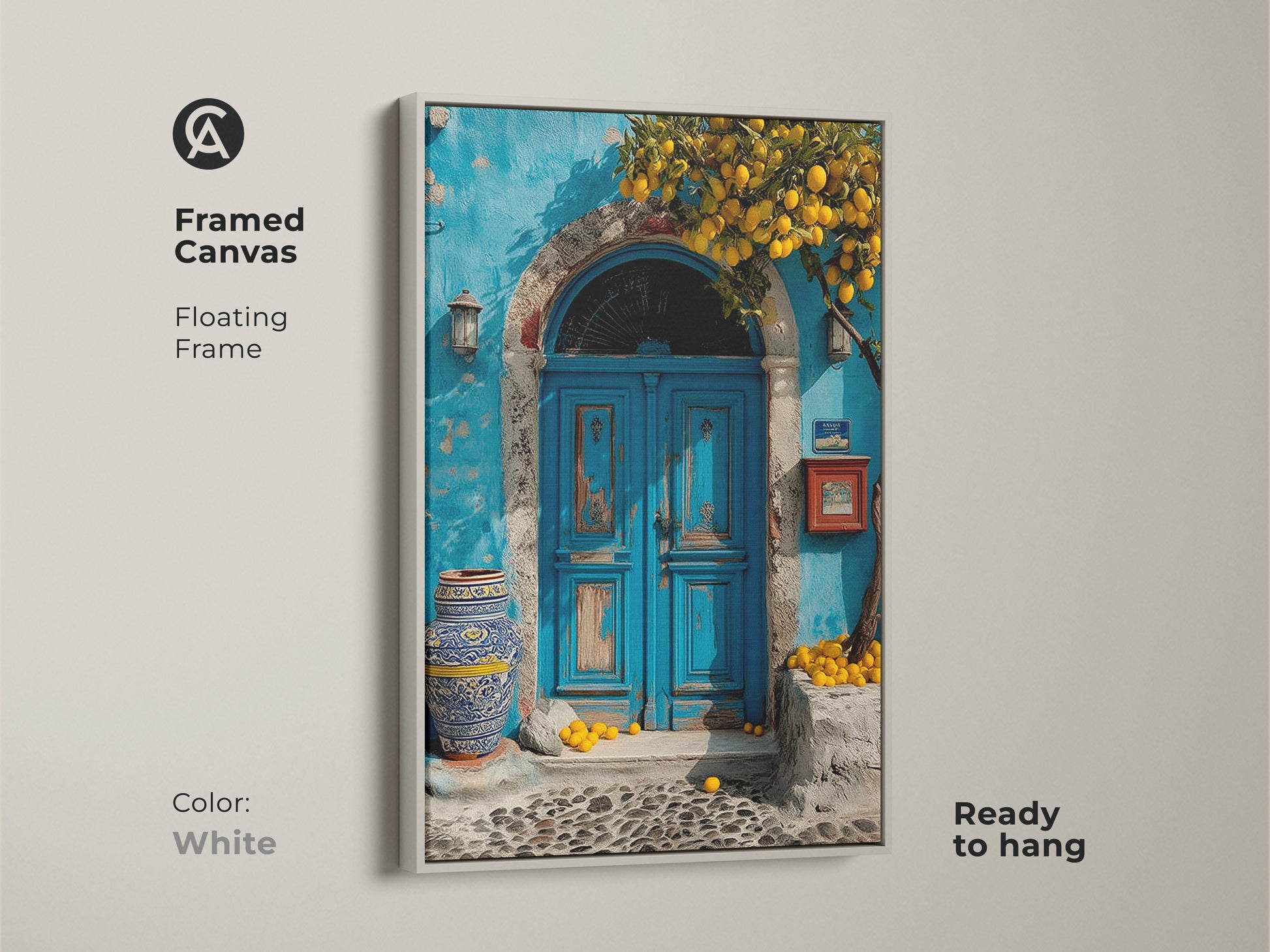Framed Canvas features a Mediterranean blue door and lemon tree. The floating frame is white. This boho coastal art is a travel lovers gift. Ready to hang this azure and yellow artwork adds a touch of Mediterranean charm to your home.