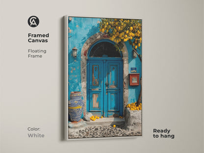 Framed Canvas features a Mediterranean blue door and lemon tree. The floating frame is white. This boho coastal art is a travel lovers gift. Ready to hang this azure and yellow artwork adds a touch of Mediterranean charm to your home.