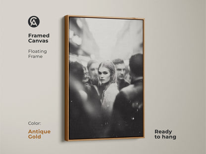 Elevate your space with framed black and white artwork. This monochrome street photography features a woman's portrait. The antique gold floating frame adds a touch of elegance. Ready to hang in your bedroom or living room. Perfect for contemporary aesthetic home decor. The gold frame enhances the urban fine art print.