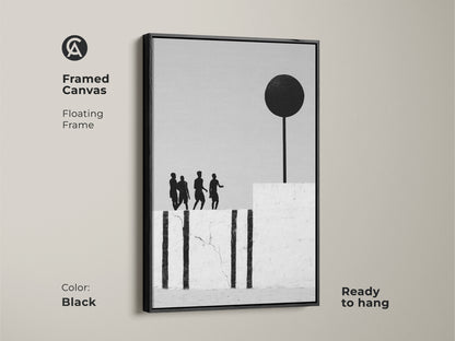 Framed canvas featuring modern abstract artwork with a floating black frame. Ready to hang the monochrome figures with black sphere provide a minimalist home decor look. The contemporary figurative art will enhance any space.