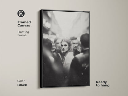 Elevate your space with framed black and white wall art. This monochrome street photography features a woman's portrait. The floating frame adds a touch of sophistication. Ready to hang in your bedroom or living room. Perfect for contemporary aesthetic home decor. The black frame enhances the urban fine art print.