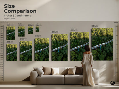 Size comparison of aerial train canvas art in inches and centimeters. Visualize 20x30 to 45x67 inch prints. See how forest landscape wall art fits your space. Modern transportation prints for contemporary decor. Choose the perfect green nature photography size.