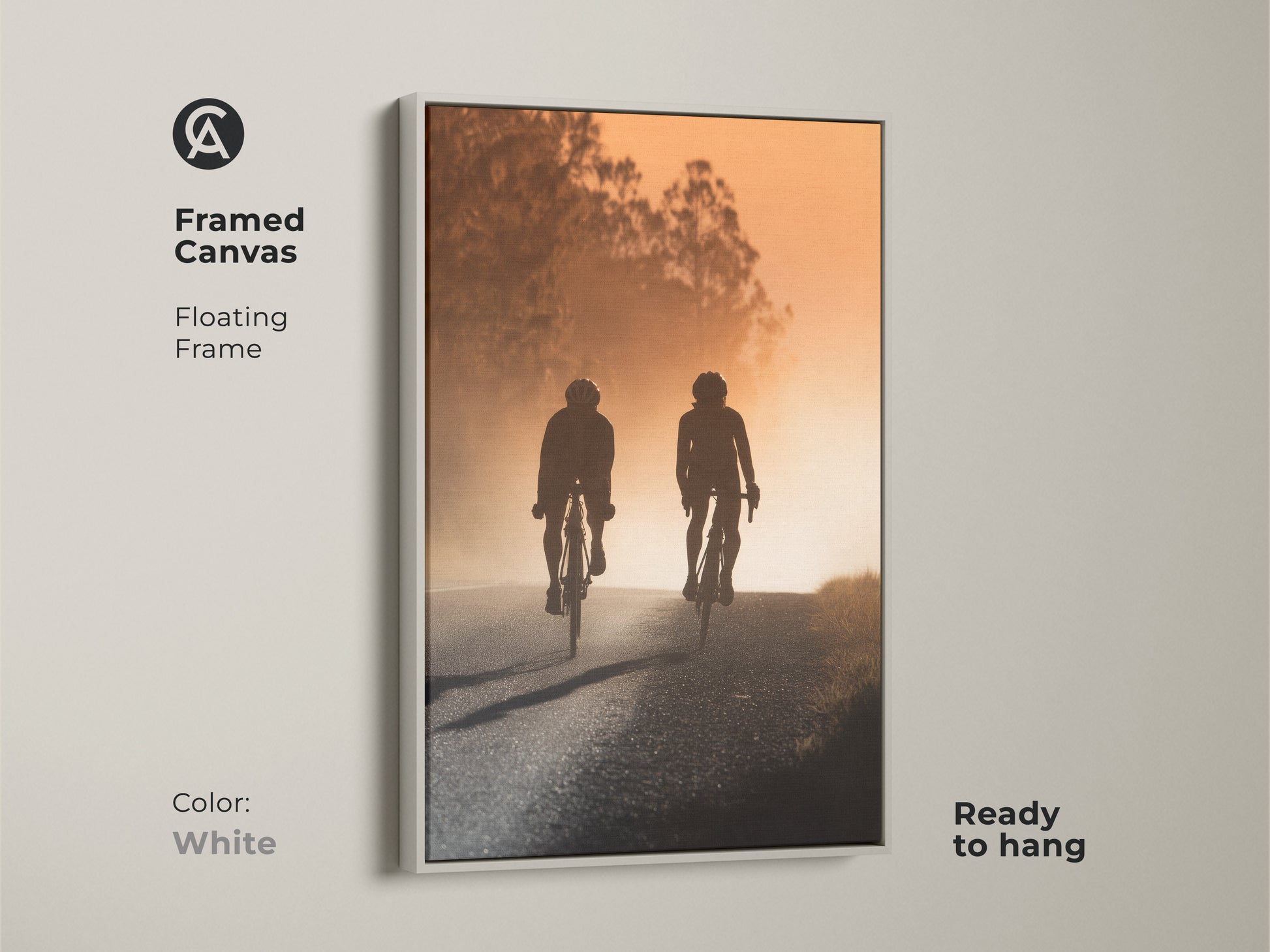 Framed canvas art featuring a cycling couple silhouette. The modern road artwork has a floating white frame and is ready to hang. Perfect modern entryway home decor or a unique gift for cyclists. Captures a sense of journey and shared experience.