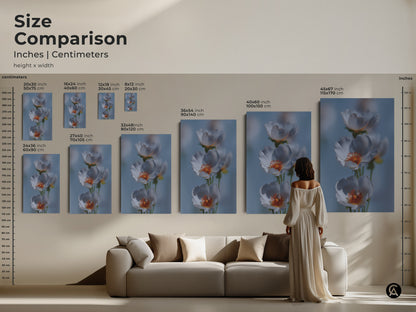 Size comparison of delicate white flower artwork. See how the art print fits above a sofa. Visualize the light blue botanical art in different sizes. This soft focus floral canvas adds a serene touch. It makes a perfect housewarming gift and enhances any Scandinavian home decor.