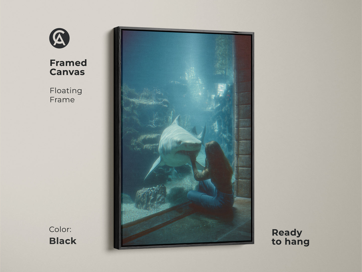 Framed Canvas Oceanic Encounter art with floating black frame. The blue green underwater scene features a woman and shark. Ready to hang marine life decor. A unique housewarming gift for animal lovers. This contemporary canvas enhances any room with its deep sea creature print. Perfect for ocean art lovers.