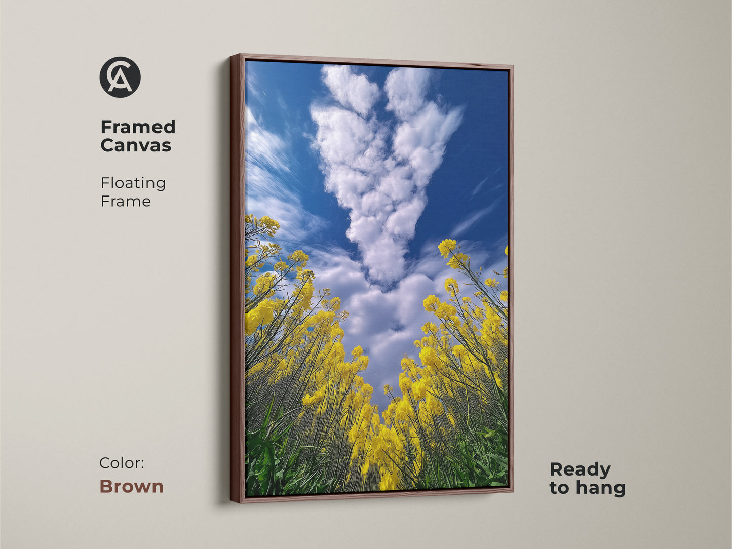 Framed canvas in brown. Features yellow canola field artwork. The floating frame complements the landscape. Blue sky and clouds add depth to this nature print. Ready to hang this impressionistic style artwork will enhance any room.