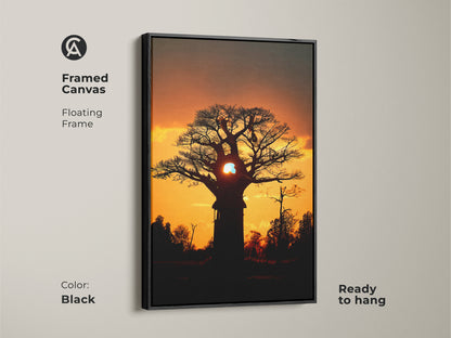 Framed canvas featuring a silhouetted african sunset landscape. Black floating frame complements the orange yellow nature print. Ready to hang as bedroom wall decor sunset. A unique piece of residential landscape art. This baobab tree art is perfect for an eclectic home.