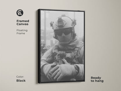 Framed canvas art print featuring a soldier in black and white. The floating frame adds depth. This ready-to-hang piece in black enhances any room with its strong military theme artwork.